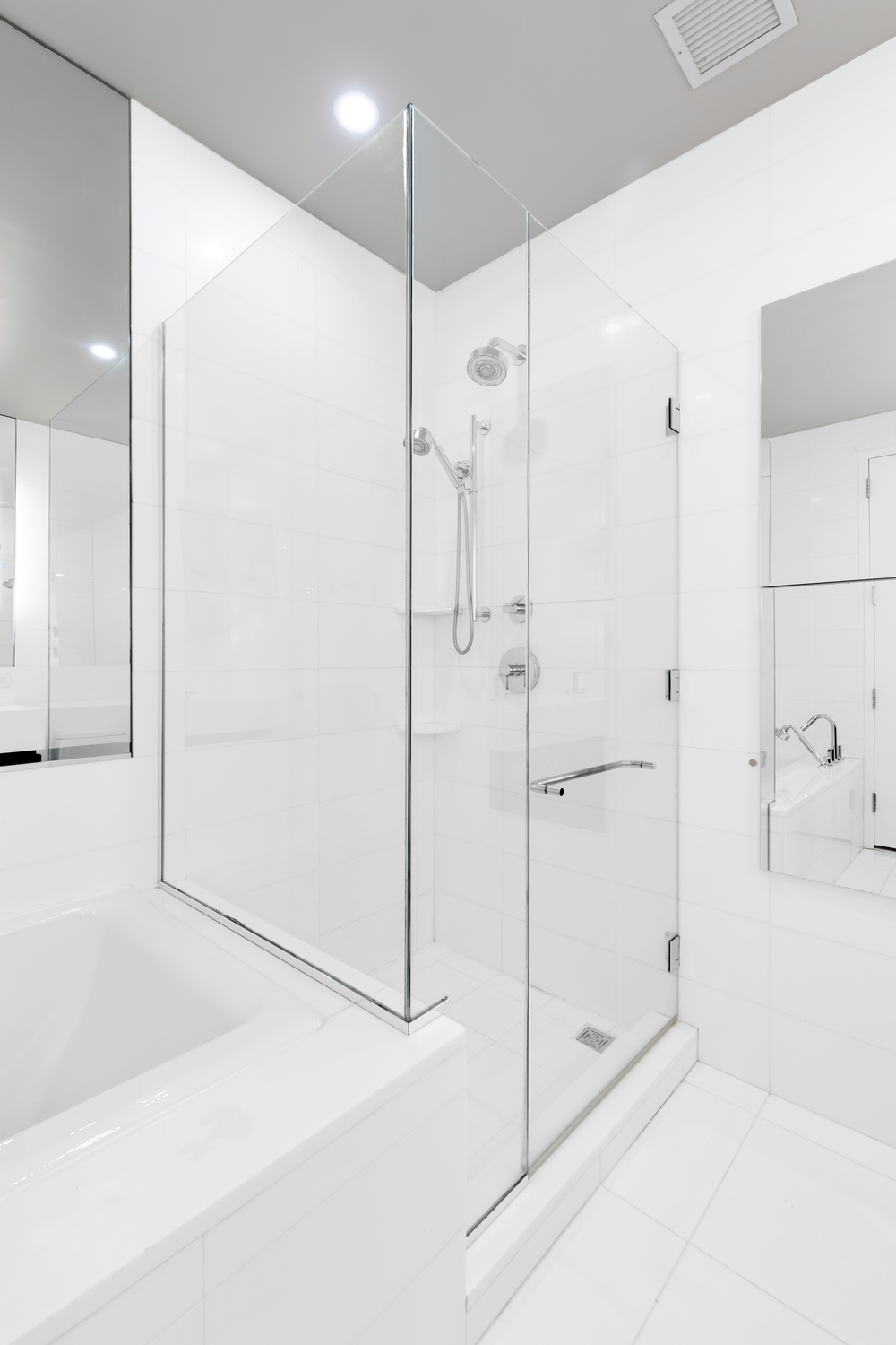 remodeled bathroom with glass shower doors